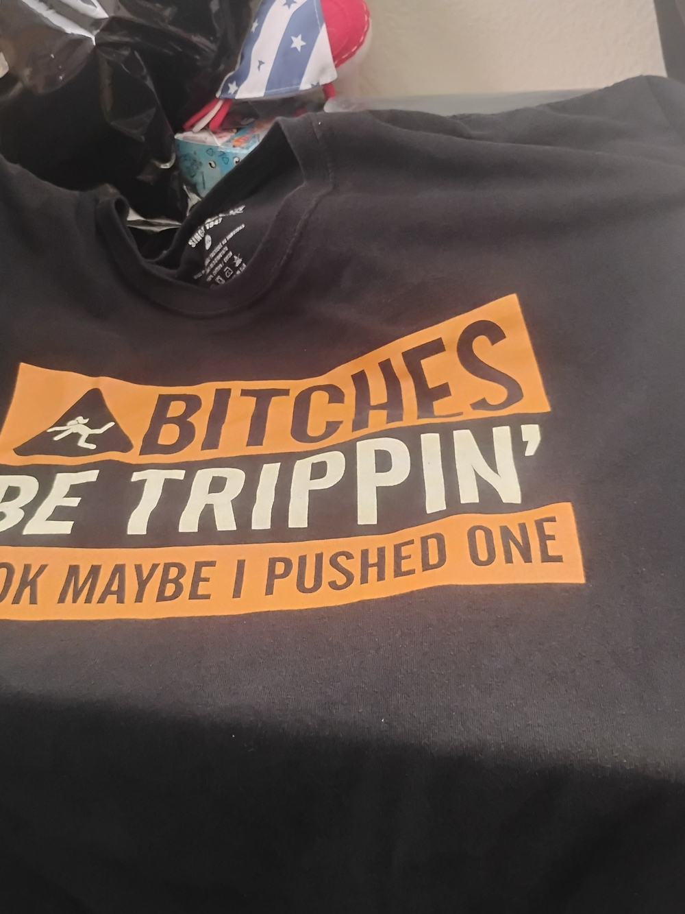 Spencer's Black Tee with White Logo and Care Print